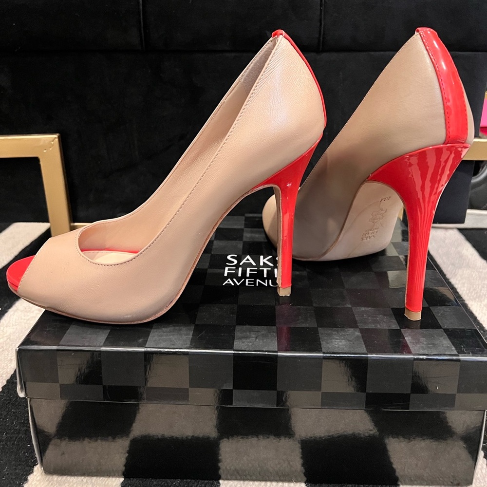 Beautiful peep toe Saks pumps, barely worn.